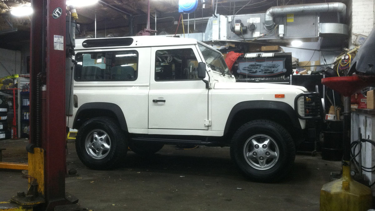 image of a white Land Rover under repair in Autobahn Centre's Shop